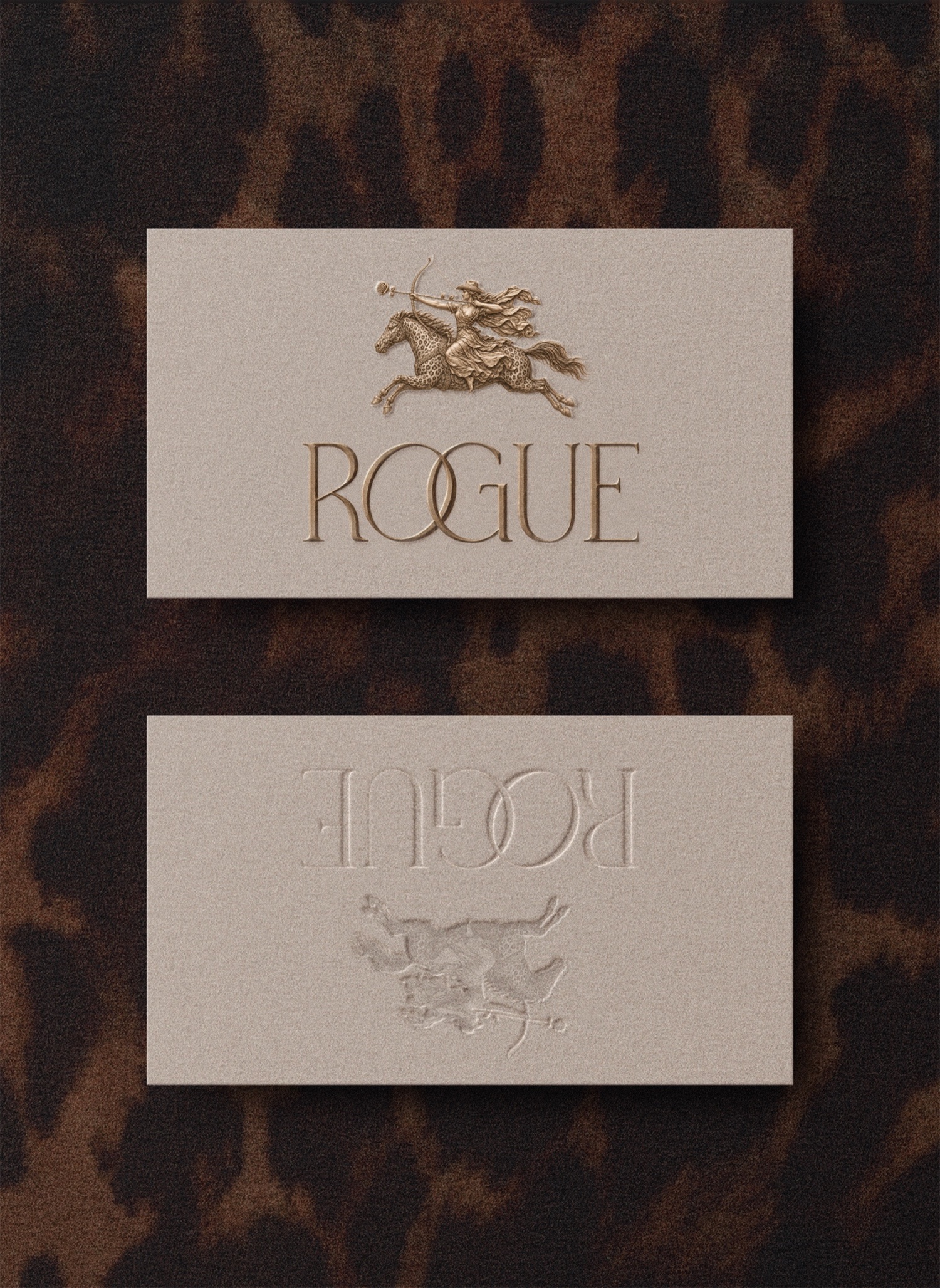 Rogue gold embossed business card and leopard print brand collateral by studio rjl