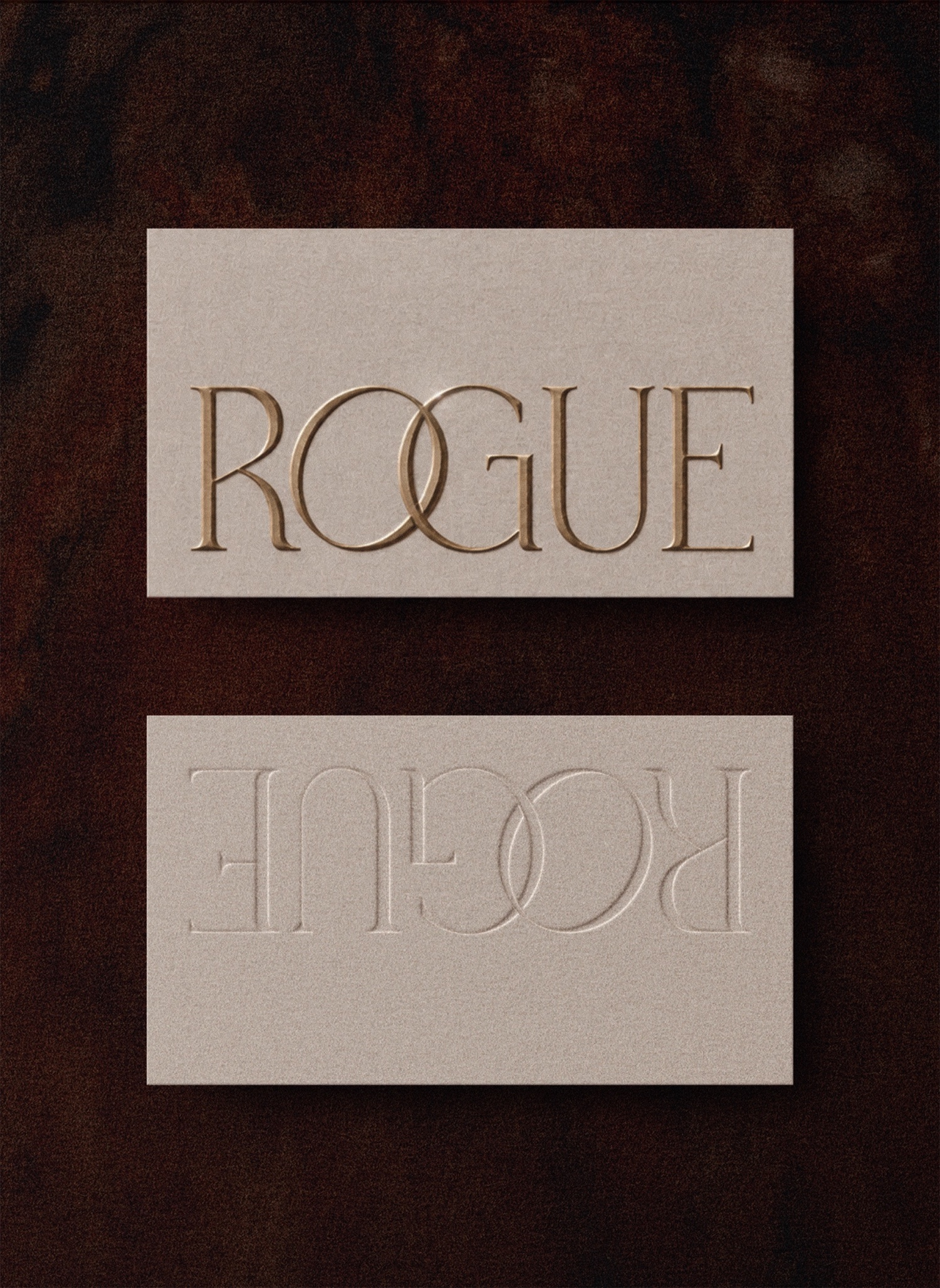 Rogue horizontal card suite with gold embossed wordmark, unbleached paper stock and blind letterpress reverse