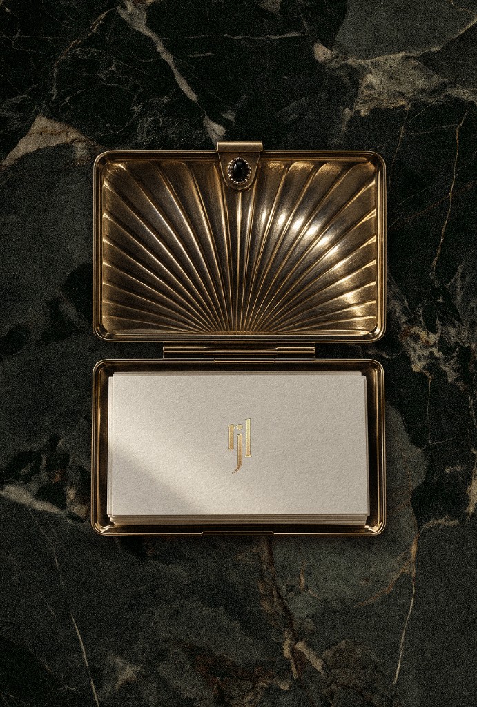 Gold travel card case holding monogrammed stationery, a studio rjl branding case for a Bangalow and Byron Bay design studio